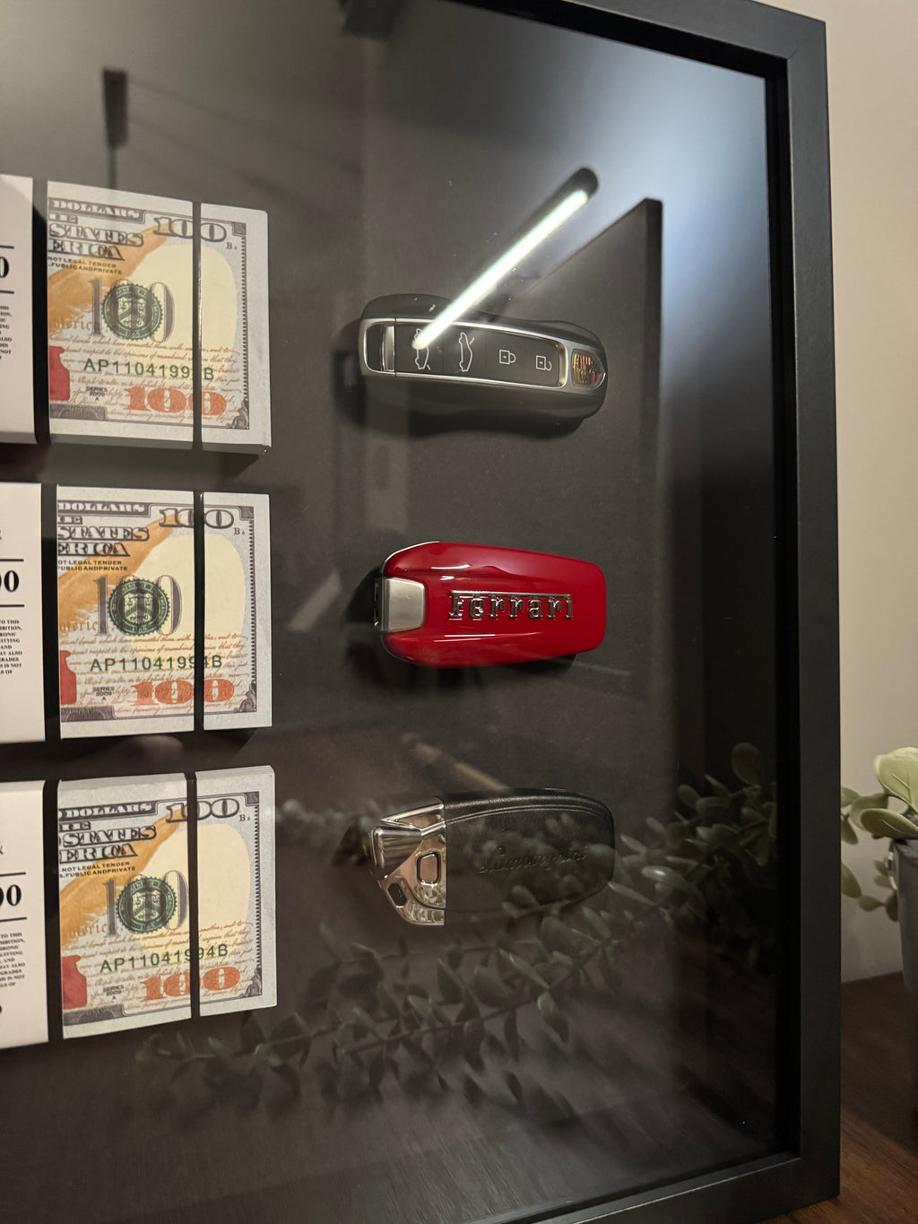 The Wealth Display – USD & Supercar Keys