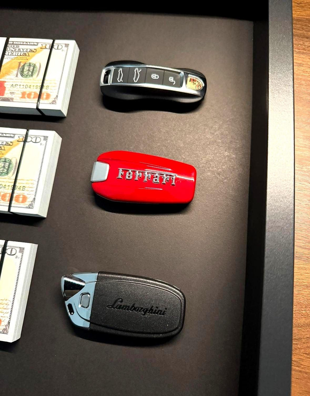 The Wealth Display – USD & Supercar Keys
